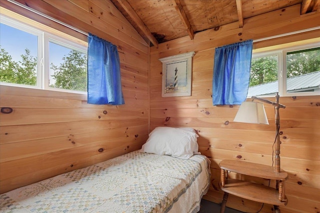 bedroom featuring wood ceiling, vaulted ceiling with beams, wood walls, and multiple windows