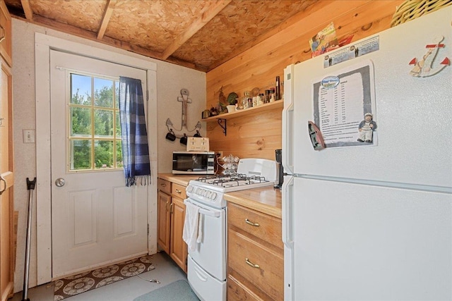 kitchen with open shelves, light countertops, white appliances, brown cabinetry, and wood walls