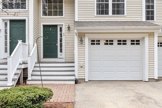 68 Barrington Ave, Nashua, NH 03062 - entrance to property with a garage and a shingled roof
