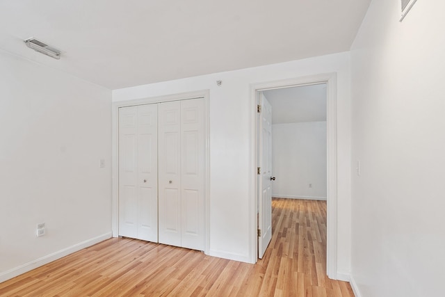68 Barrington Ave, Nashua, NH 03062 - unfurnished bedroom featuring light wood-type flooring, a closet, baseboards, and visible vents