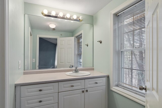 68 Barrington Ave, Nashua, NH 03062 - bathroom with vanity and a healthy amount of sunlight
