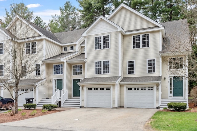 68 Barrington Ave, Nashua, NH 03062 - townhome / multi-family property featuring a shingled roof, driveway, and an attached garage