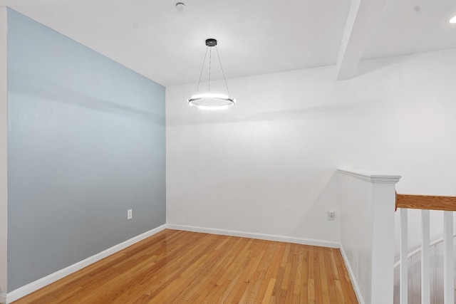68 Barrington Ave, Nashua, NH 03062 - empty room with beamed ceiling, light wood-style flooring, and baseboards