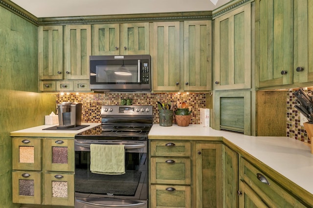 23 Bear Hill Rd, Windham, NH 03087 - kitchen featuring stainless steel range with electric cooktop, green cabinets, decorative backsplash, light countertops, and glass insert cabinets