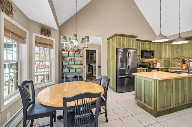 23 Bear Hill Rd, Windham, NH 03087 - dining area with a baseboard heating unit, high vaulted ceiling, a chandelier, and light tile patterned flooring