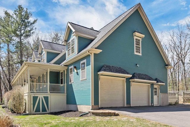 23 Bear Hill Rd, Windham, NH 03087 - view of side of property with an attached garage, asphalt driveway, and roof with shingles