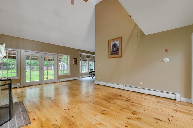 23 Bear Hill Rd, Windham, NH 03087 - unfurnished living room with a baseboard radiator, baseboard heating, hardwood / wood-style flooring, ceiling fan, and french doors
