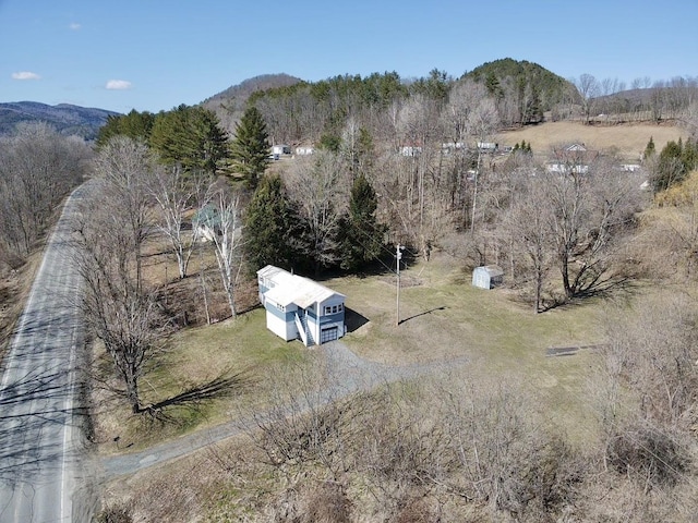 aerial view featuring a rural view, a mountain view, and a forest view