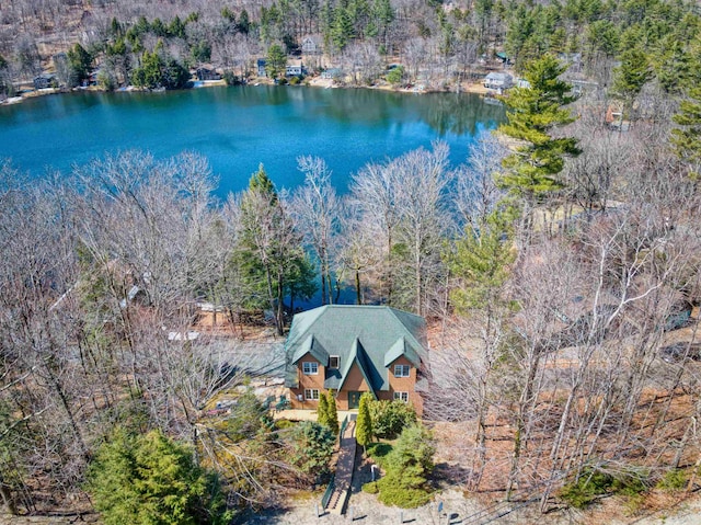 aerial view with a water view and a forest view