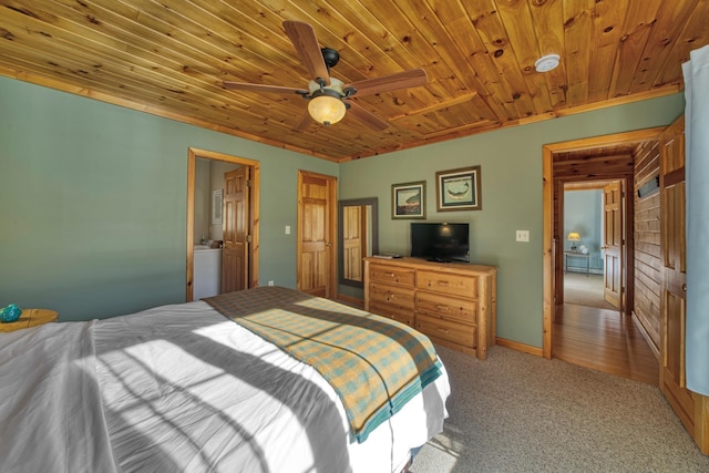 carpeted bedroom with wood ceiling and a ceiling fan