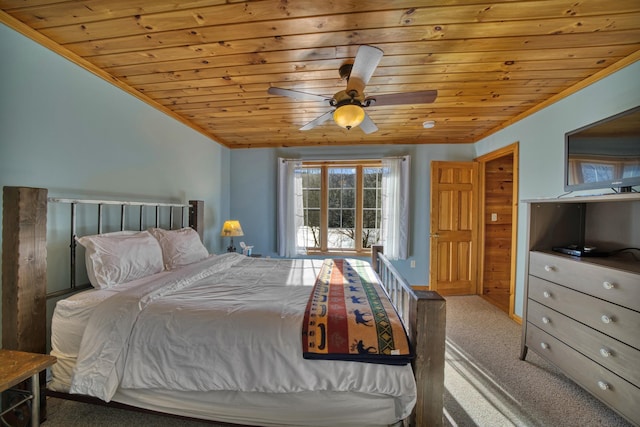 carpeted bedroom featuring wooden ceiling and a ceiling fan