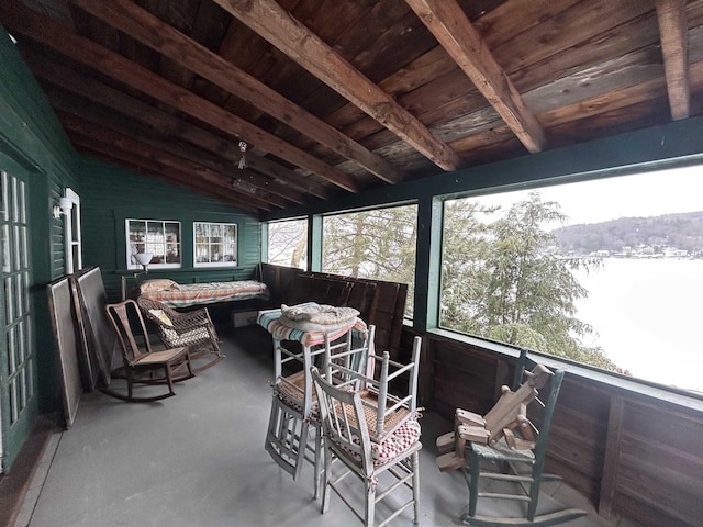 sunroom with beam ceiling