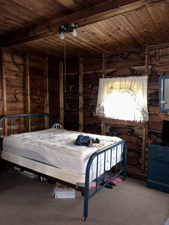 bedroom featuring wooden walls, carpet floors, and wooden ceiling