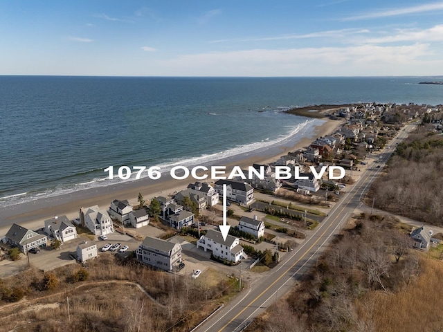 aerial view featuring a water view and a view of the beach