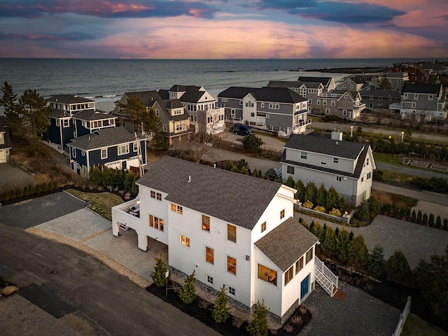 birds eye view of property featuring a residential view and a water view