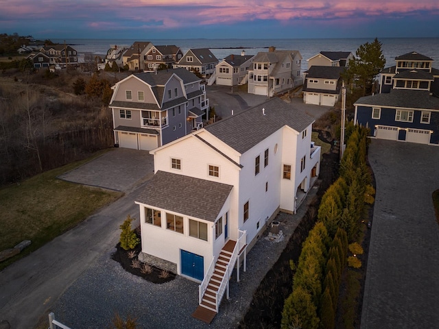 bird's eye view with a water view and a residential view