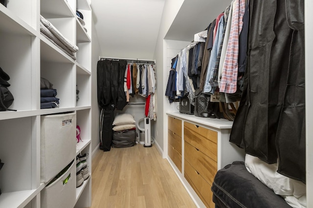 walk in closet featuring light wood-style flooring