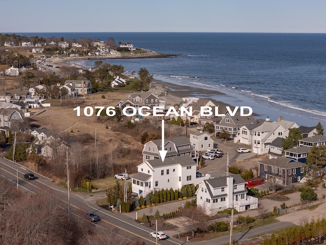 bird's eye view with a residential view and a water view