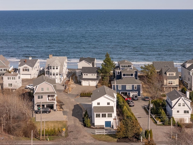 drone / aerial view with a residential view and a water view