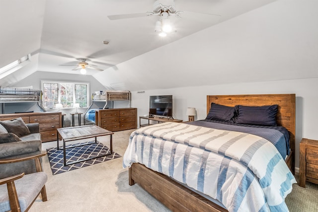bedroom featuring carpet flooring, a ceiling fan, and lofted ceiling