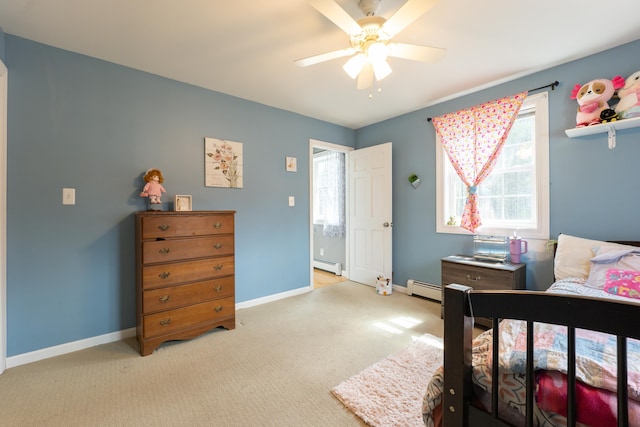 bedroom featuring baseboard heating, baseboards, light colored carpet, and a ceiling fan