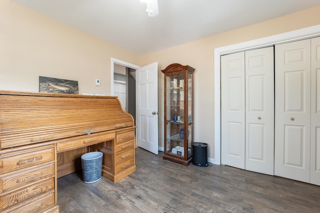 unfurnished office with dark wood-type flooring