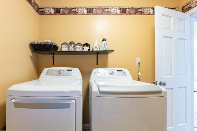 laundry room featuring washing machine and dryer
