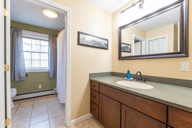bathroom featuring a baseboard radiator, tile patterned flooring, vanity, baseboards, and toilet