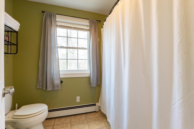 bathroom featuring baseboard heating, toilet, and tile patterned floors