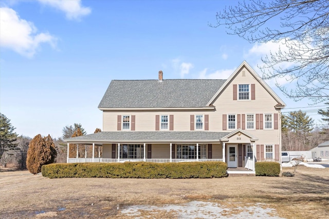 33 Bunker Hill Rd, Auburn, NH 03032 - view of front facade with a porch, a chimney, and a shingled roof