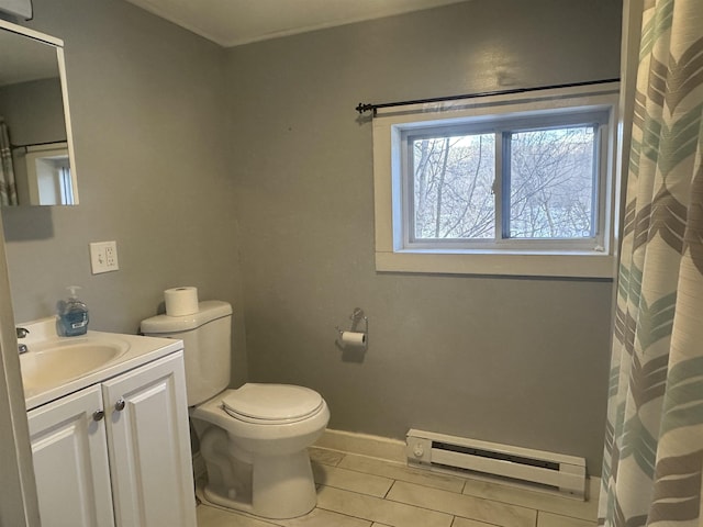 bathroom with tile patterned floors, toilet, vanity, baseboards, and a baseboard radiator