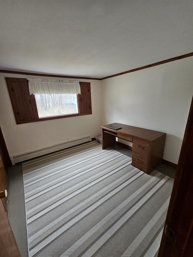 unfurnished bedroom featuring a baseboard heating unit, carpet floors, and ornamental molding