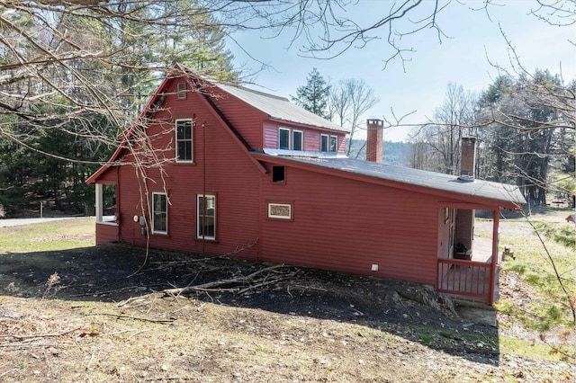 view of property exterior with a chimney