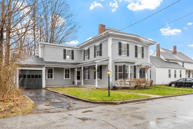 10 Crescent St, Wilton, NH 03086 - view of front facade with a front yard, driveway, and a chimney