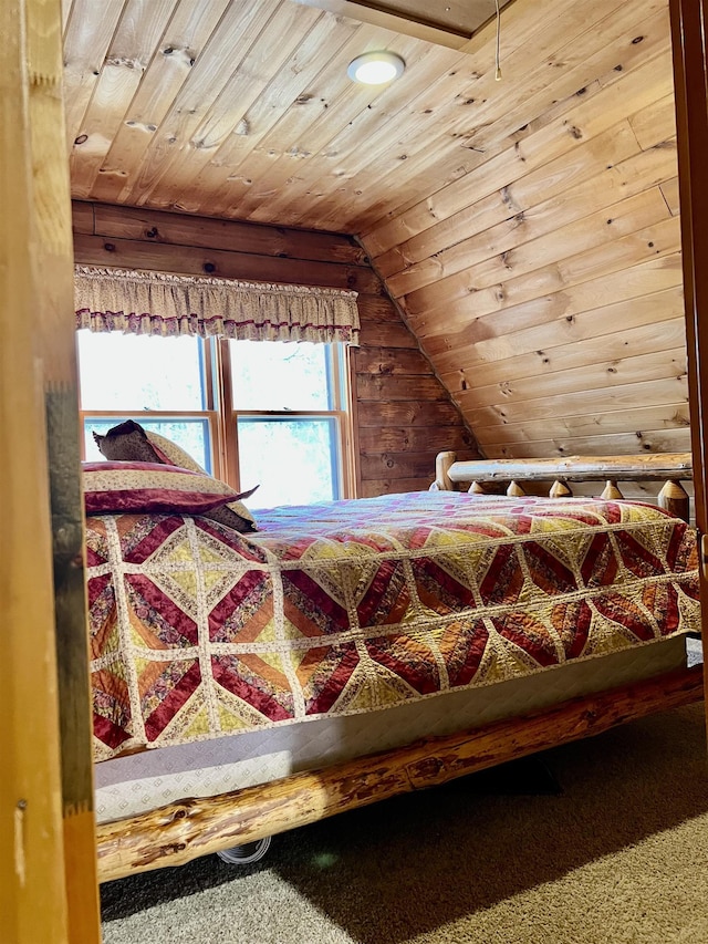 carpeted bedroom featuring wood ceiling and vaulted ceiling