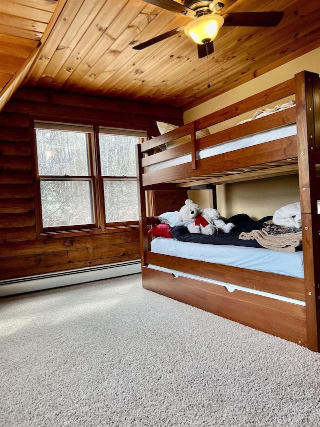 bedroom with wood ceiling, a baseboard radiator, and carpet floors