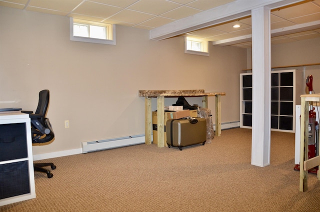 carpeted office featuring a paneled ceiling, a baseboard radiator, and baseboard heating