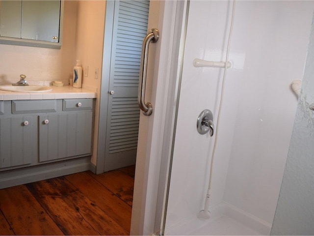 1419 Stonebridge Rd, Georgia, VT 05468 - bathroom with a shower stall, vanity, and wood finished floors
