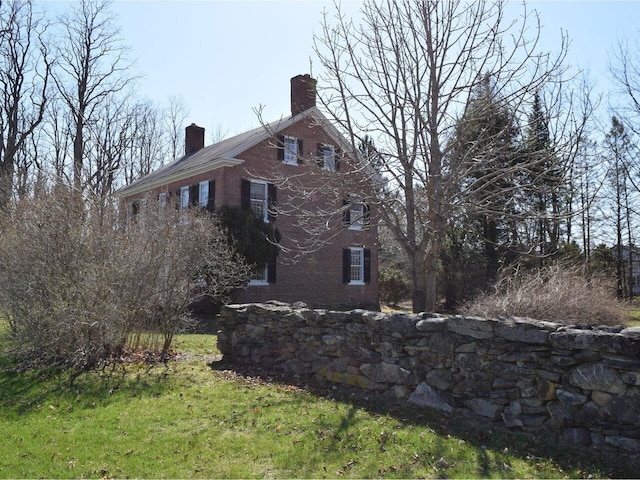 1419 Stonebridge Rd, Georgia, VT 05468 - view of property exterior featuring a chimney and brick siding
