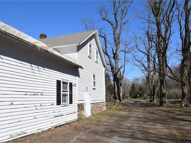 1419 Stonebridge Rd, Georgia, VT 05468 - view of property exterior with a chimney and metal roof