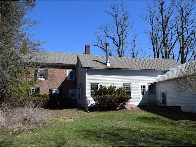 1419 Stonebridge Rd, Georgia, VT 05468 - view of side of property featuring a yard, a chimney, and metal roof