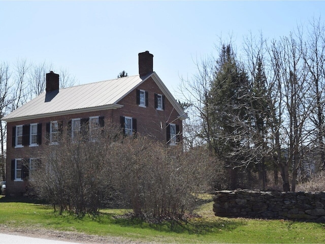 1419 Stonebridge Rd, Georgia, VT 05468 - view of side of property with a chimney and metal roof