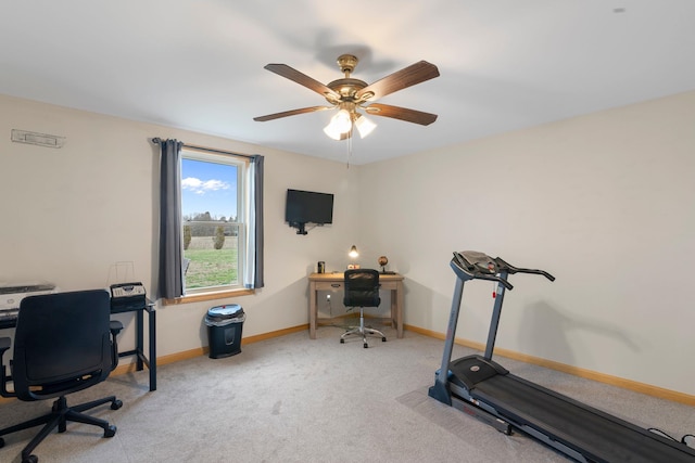 office area featuring a ceiling fan, baseboards, and carpet floors