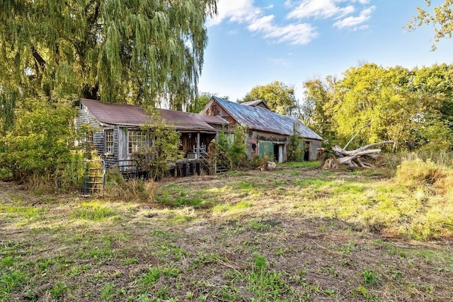 back of property with metal roof