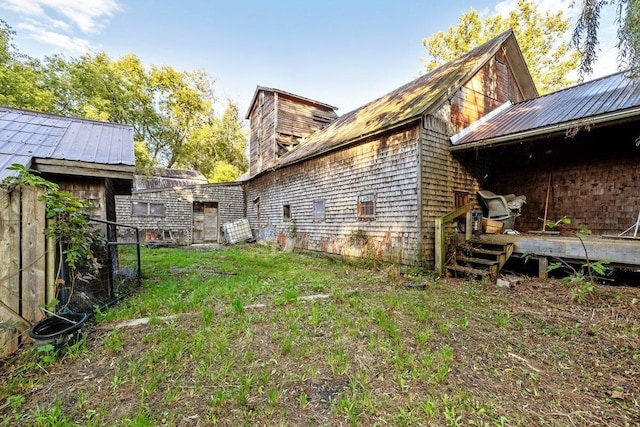 exterior space featuring a chimney and a wooden deck