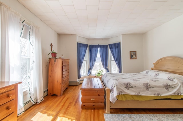 bedroom with light wood finished floors