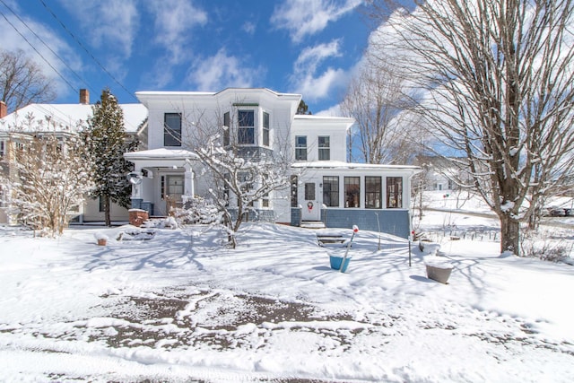 rear view of house with a sunroom