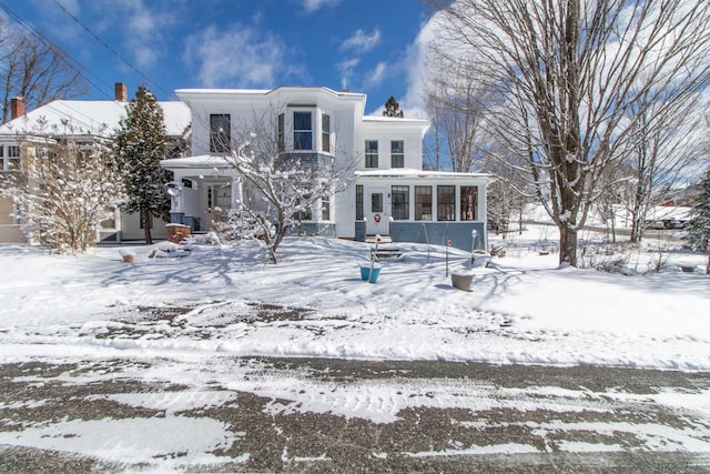 rear view of house with a sunroom