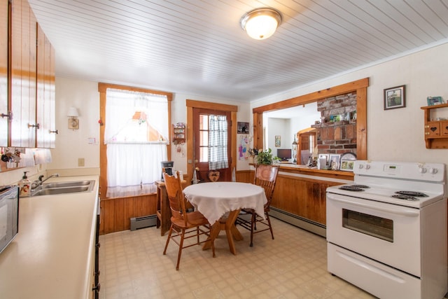 kitchen featuring white electric stove, light floors, a sink, and a baseboard radiator