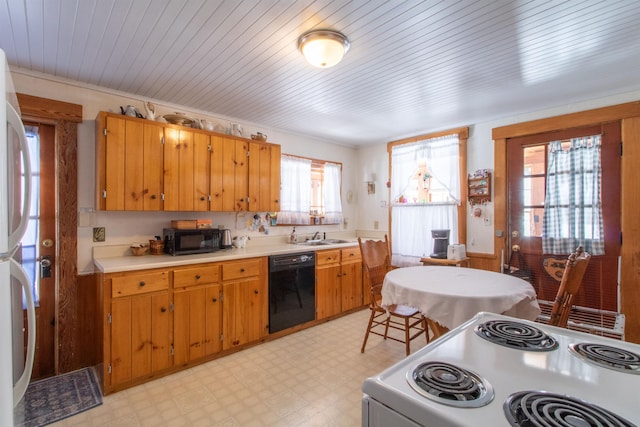 kitchen with light floors, black appliances, brown cabinets, and light countertops